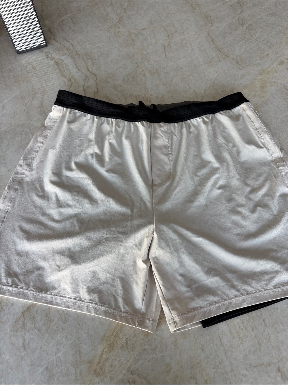 RHONE Cream Athletic Shorts with Black Waistband and Drawcord